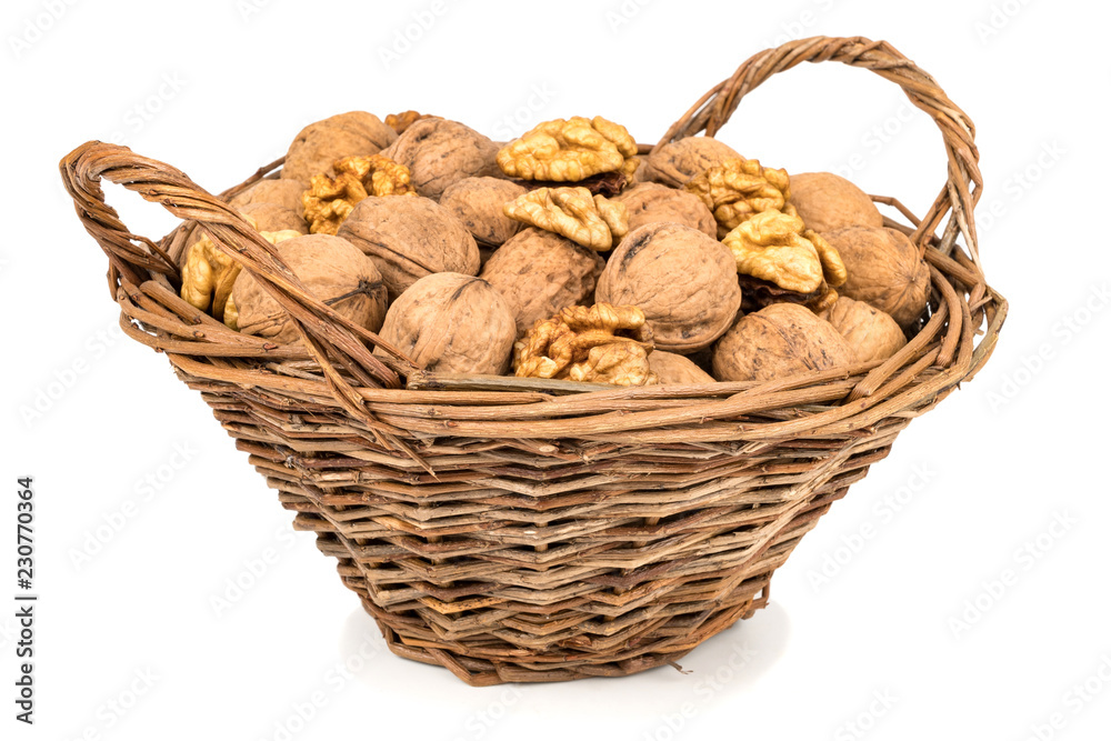 Walnut in a basket isolated over white background. Walnut in a basket isolated over white background.