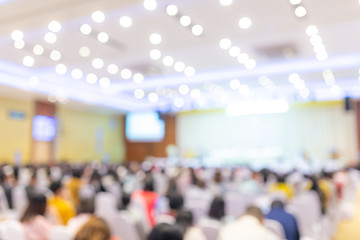 Abstract blurred photo of conference hall or seminar room with attendee background