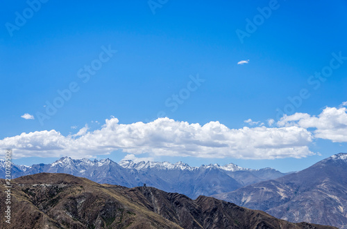 Desert and mountain over blue sky and white clouds on altiplano