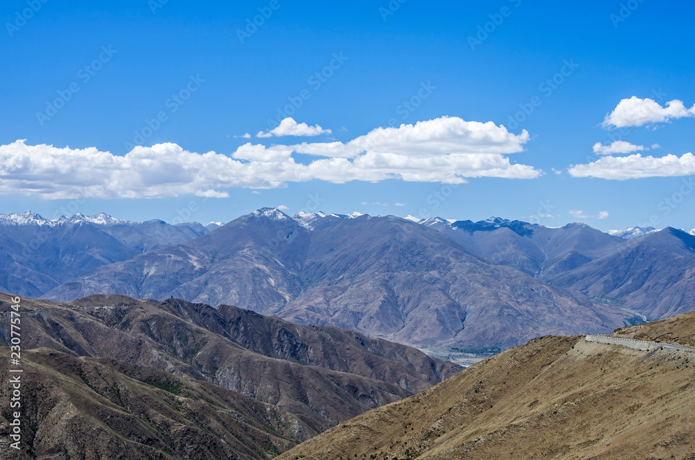 Desert and mountain over blue sky and white clouds on altiplano Desert and mountain over blue sky and white clouds on altiplano