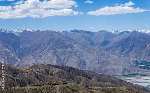 Desert and mountain over blue sky and white clouds on altiplano