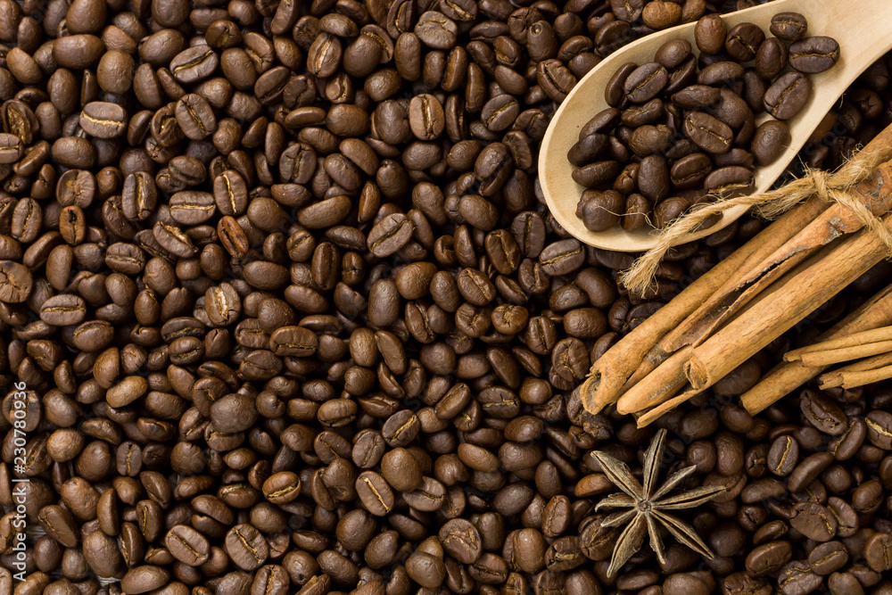 Fototapeta premium Coffee with cinnamon on a wooden table. Top view from above
