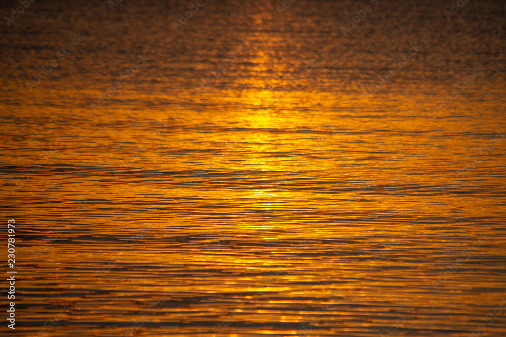 Dettail of water at sunset reflections