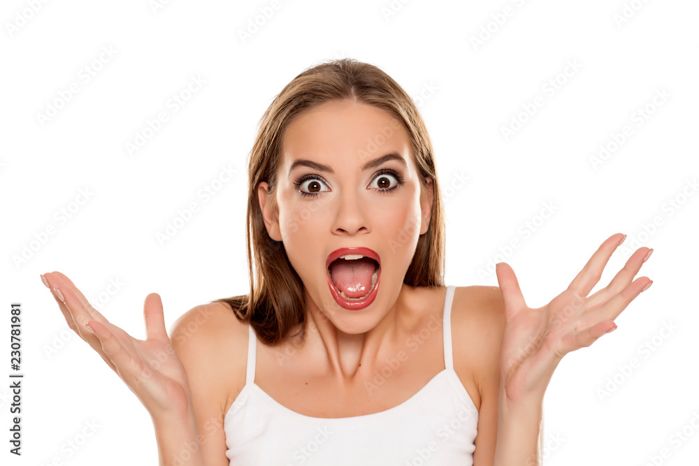 Beautiful shocked girl on white background Beautiful shocked girl on white background