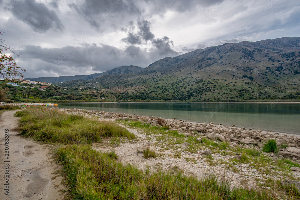 View of lake Kournas on Crete and clouds over the mountains