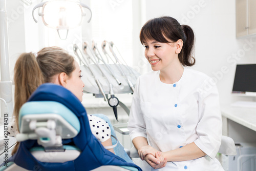Dentist advises the patient at the clinic
