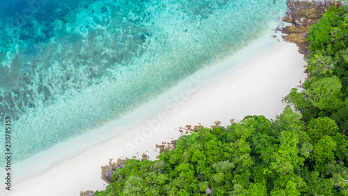 Aerial top view beautiful tropical island with white sand beach and blue clear water, Top view above coral reef, Andaman sea, Myanmar.