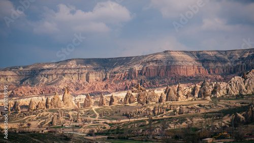 Colorful Red mountain valley in Cappadocia landscape with dramatic sky