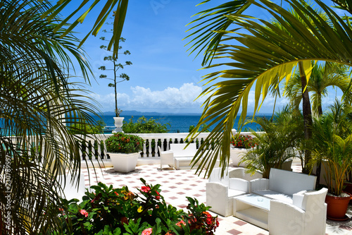 Terrace with view over the ocean, beautiful chill out lounge with tropical plants and view over the caribbean sea