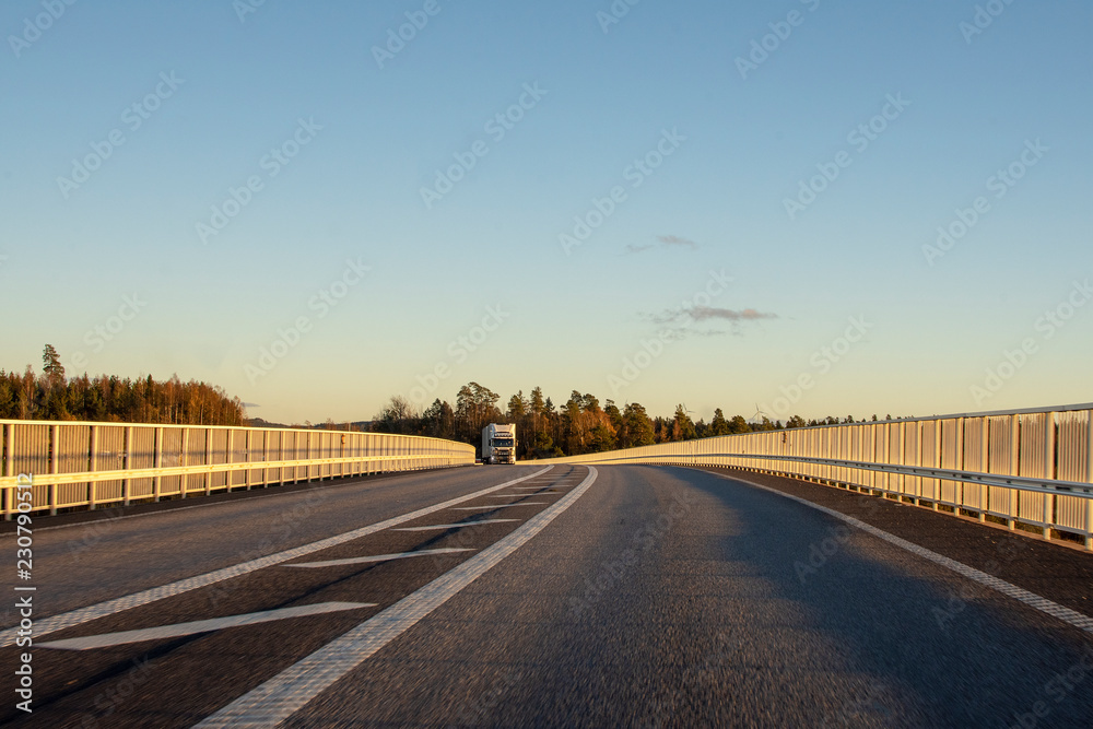 Truck approaching on highway a sunny clear day. Truck approaching on highway a sunny clear day.