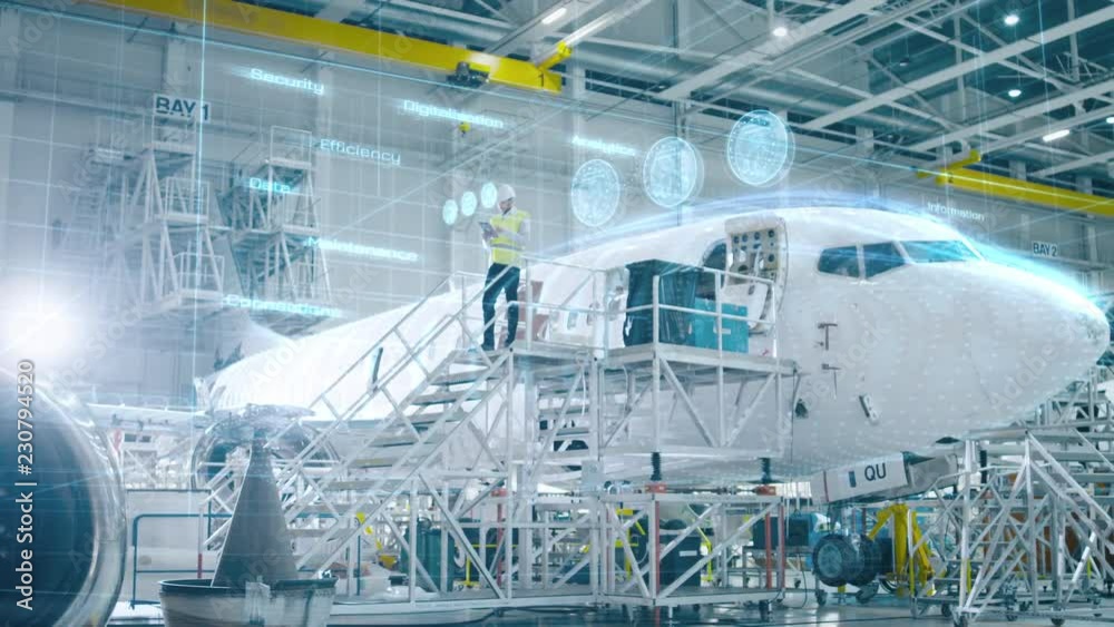 Concept of: In Hangar Engineer Holding Tablet Computer Standing On a Ramp Near Airplane Conducts Digitilized Maintenance Analysis. Animated 