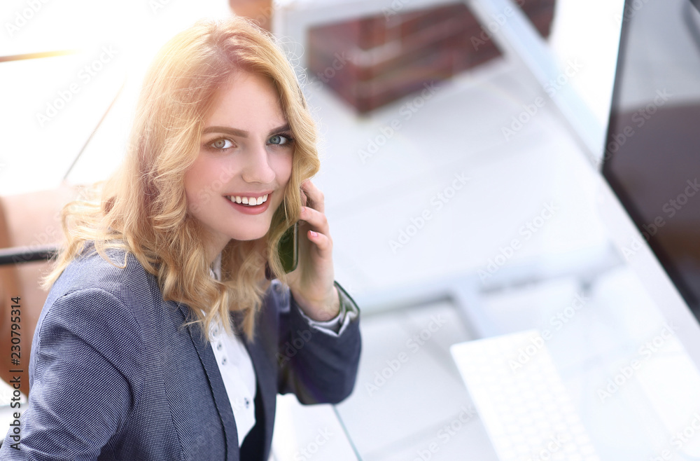 successful young business woman sitting at a Desk successful young business woman sitting at a Desk