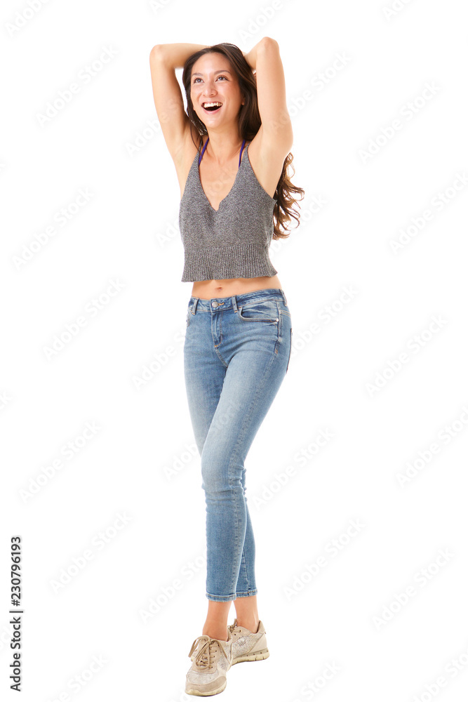 Full body young asian woman laughing with hands behind head against isolated white background Full body young asian woman laughing with hands behind head against isolated white background