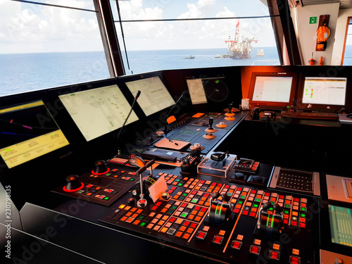 wheelhouse of a modern offshore ship with dynamic positioning systems photo