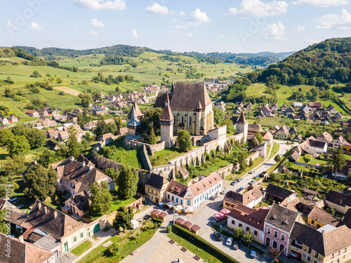 Biertan town and Biertan lutheran evangelical fortified church in Sibiu County, Transylvania, Romania. Aerial view. Biserica fortificata din Biertan, Sibiu, Transilvania, Romania photo