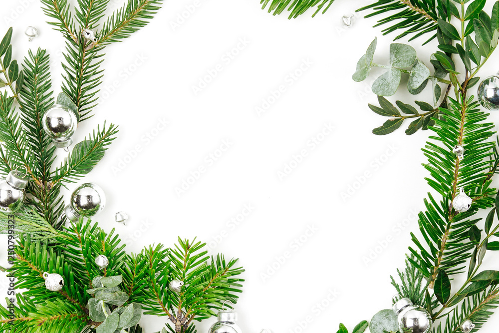 Beautiful round frame of fir and pine branches with Christmas decorations white background. Christmas concept. Flat lay, top view Beautiful round frame of fir and pine branches with Christmas decorations white background. Christmas concept. Flat lay, top view