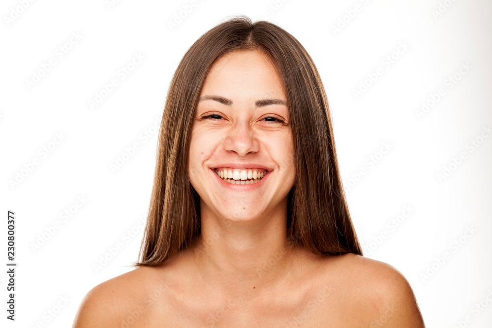 Portrait of young beautiful happy woman with no makeup on white backgeound Portrait of young beautiful happy woman with no makeup on white backgeound
