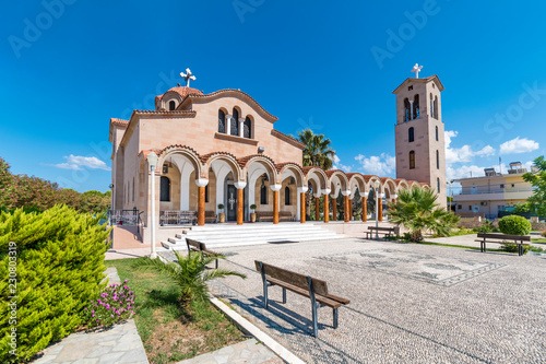 Orthodox church of Saint Nektarios with bell tower in Faliraki (Rhodes, Greece) photo