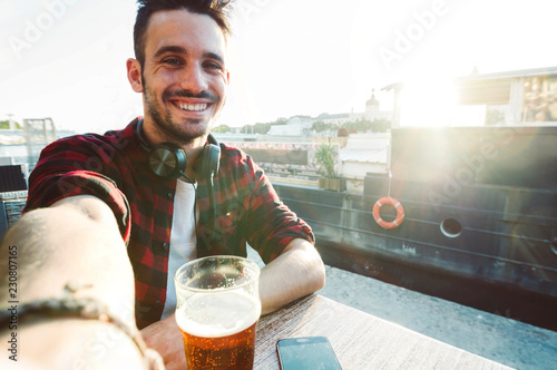Confident caucasian man taking a selfie outdoor 