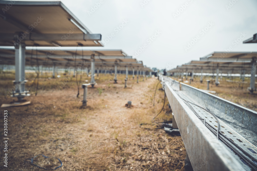 engineer and electrician installing solar power plant; scope of work at solar power plant tracking to sun