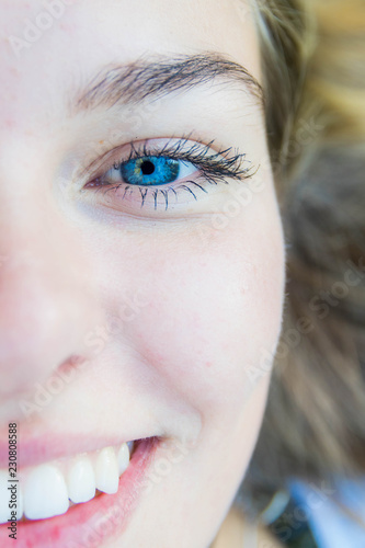 Obraz w ramie Portrait of a confident positive woman smiling at the camera, half-face