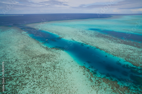 Aerial view of tropical coral reef and channel