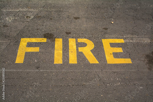 Word "fire vehicle" sign on road
