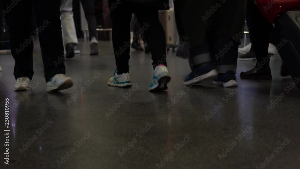 KIEV, UKRAINE - Crowd of people walking with luggage in the Boryspil International Airport Terminal, Kyiv, Ukraine KIEV, UKRAINE - Crowd of people walking with luggage in the Boryspil International Airport Terminal, Kyiv, Ukraine