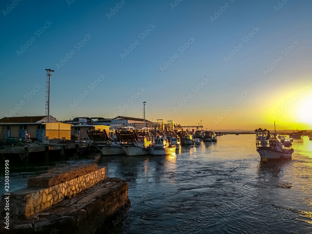 Fishing boats at sunset in Isla Cristina harbour, Huelva, province of Andalusia, Spain.