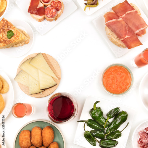 A photo of Spanish food, shot from the top. forming a frame on a white background with a place for text