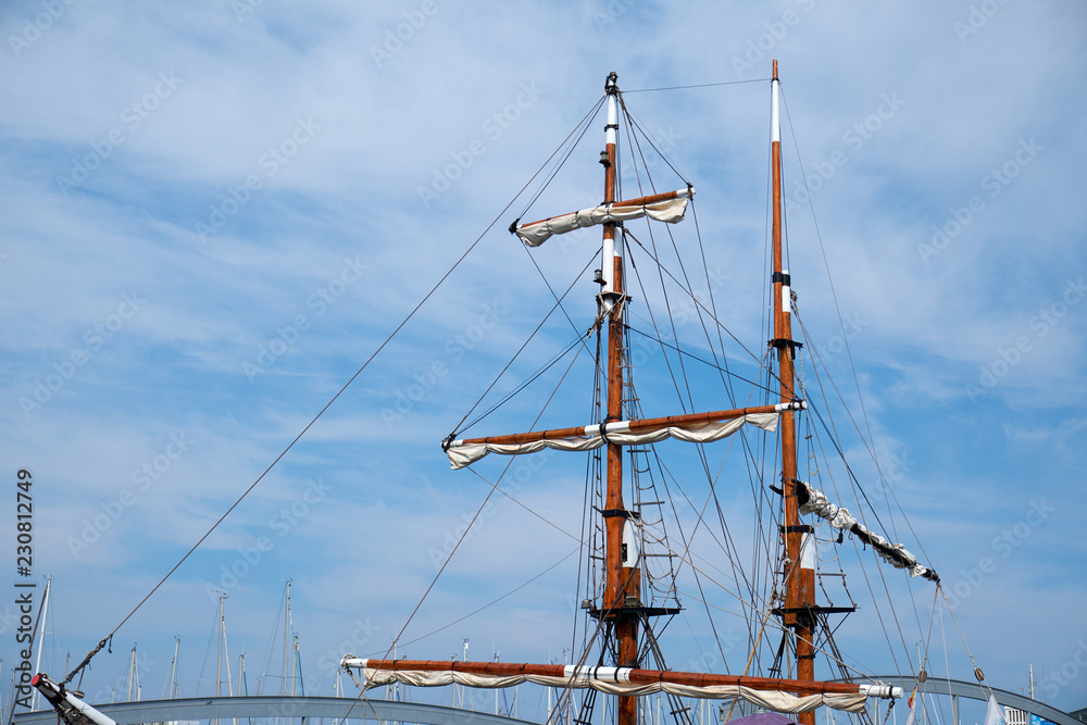 mast of the old ship against the blue sky
