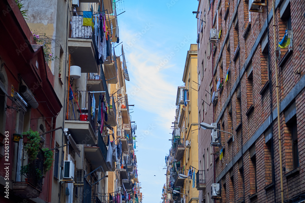 Narrow street in Barcelona. Two houses opposite