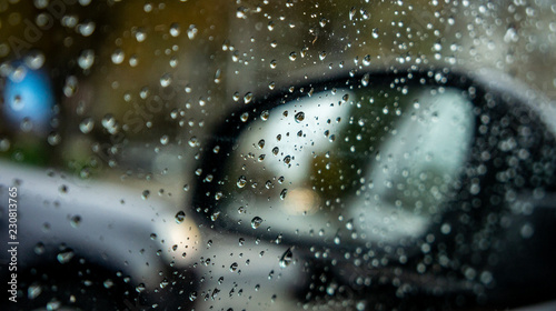 rainy weather, autumn time. drops on the vehicle's windows and blurry effect. rainy season and cold and cool weather. drops of rain on glass.
