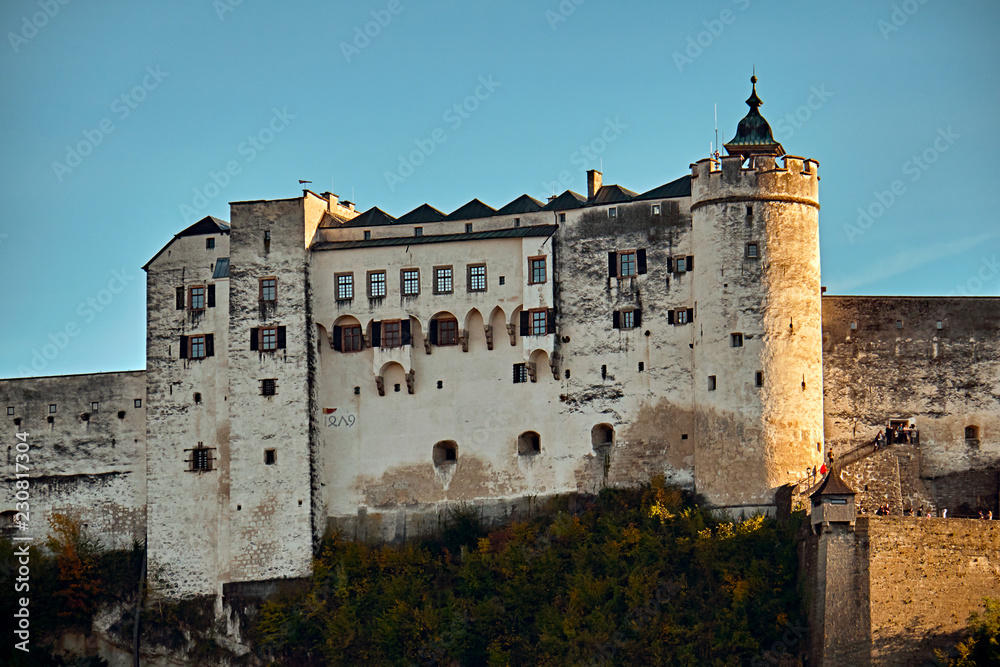 Festung Hohensalzburg Fortress in Salzburg in Austria - medieval castle at cliff under the old town. Famous landmark with summer sky