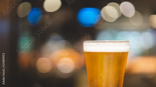 chill beer on dark background and light bokeh