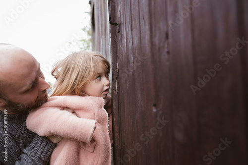 Curious little girl with father