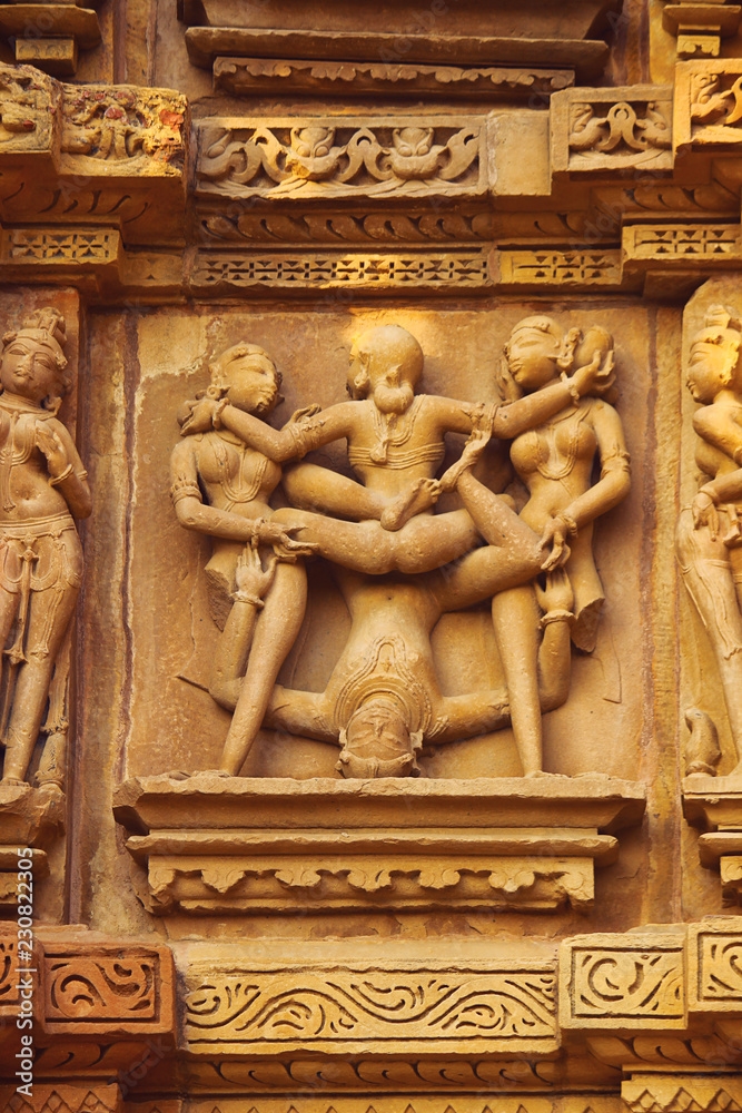 Sex Poses - Close up of Kamasutra scenes on the wall of Hindu temple in western group of temple Khajuraho, India