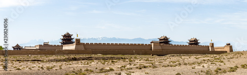View of Jiayuguan Fort with snow capped mountains on the background, Gansu, China. Known as 