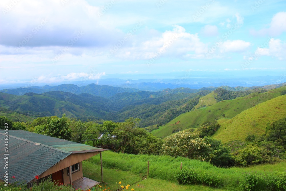 A beautiful long-distance view over the green lush and mountainus landscape - Costa Rica