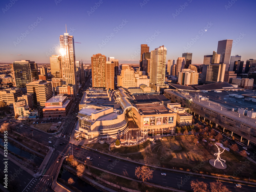 An aerial view of the skyline of the city of Denver at sunset