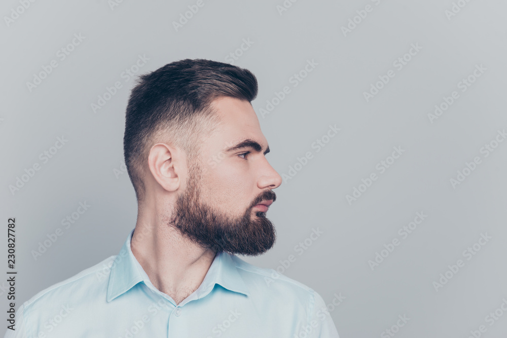 Obraz premium Close up half turned studio photo portrait of handsome focused w