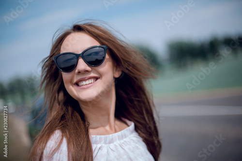 portrait of a beautiful young woman in the car