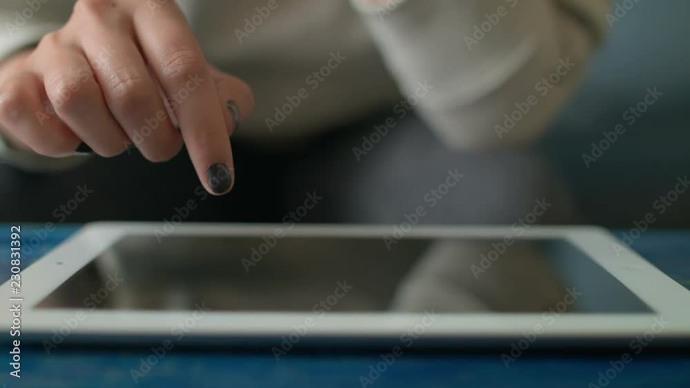 Young Woman Using Digital Tablet Ipad Computer In Cafe Young Woman Using Digital Tablet Ipad Computer In Cafe