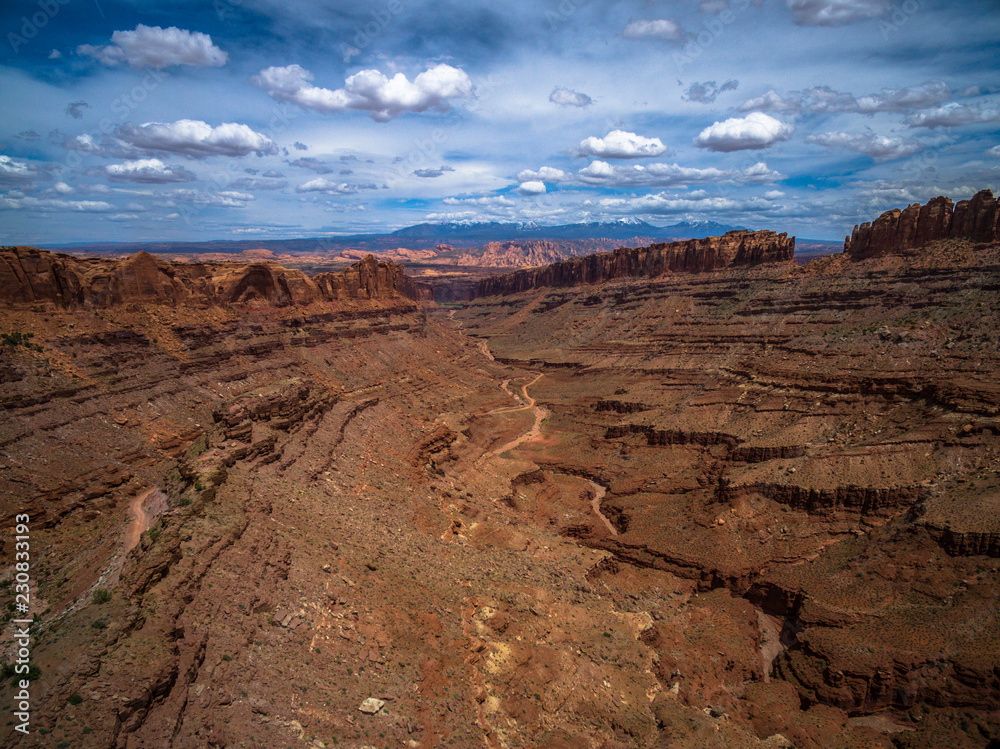 Drone/Aerial Panorama of the Vista Overlooking the Beautiful Utah Desert with the Majestic LaSalle Mountains in the Distance.  From Long Canyon Road, Moab
