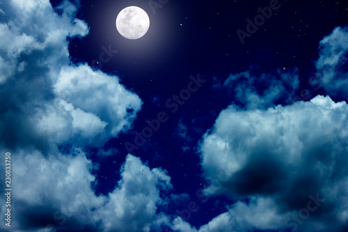 The bright night sky with full moon and white cloud.