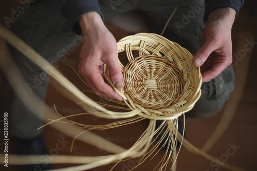 Basketwork from willow twigs in the workshop. photo