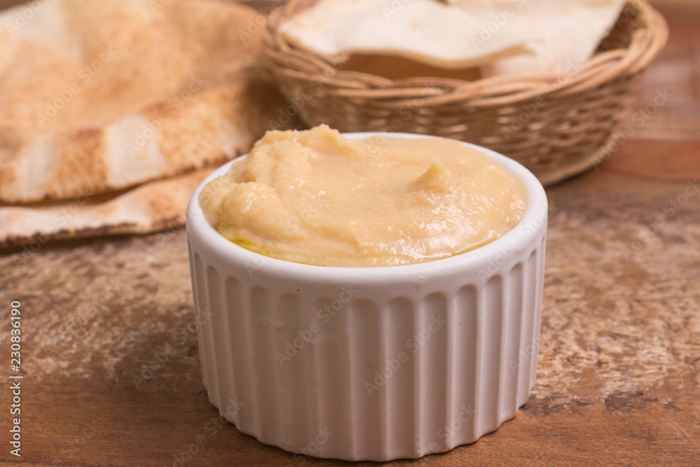 Chickpeas hummus in a bowl and arab bread Chickpeas hummus in a bowl and arab bread