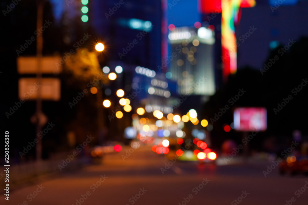 A far view blurred background of night busy city centre.