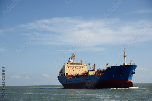 Chemical - Oil Products Tanker  vessel sailing into port on the Gulf of Mexico with sky and clouds