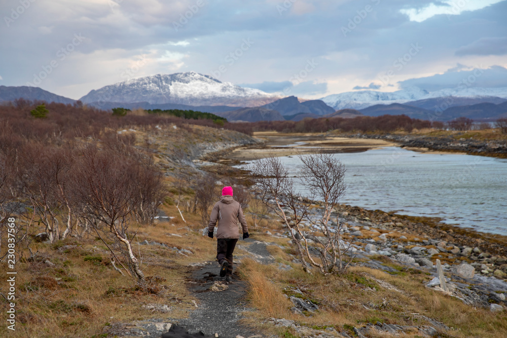 Woman happy walking in great nature, Nordland county
